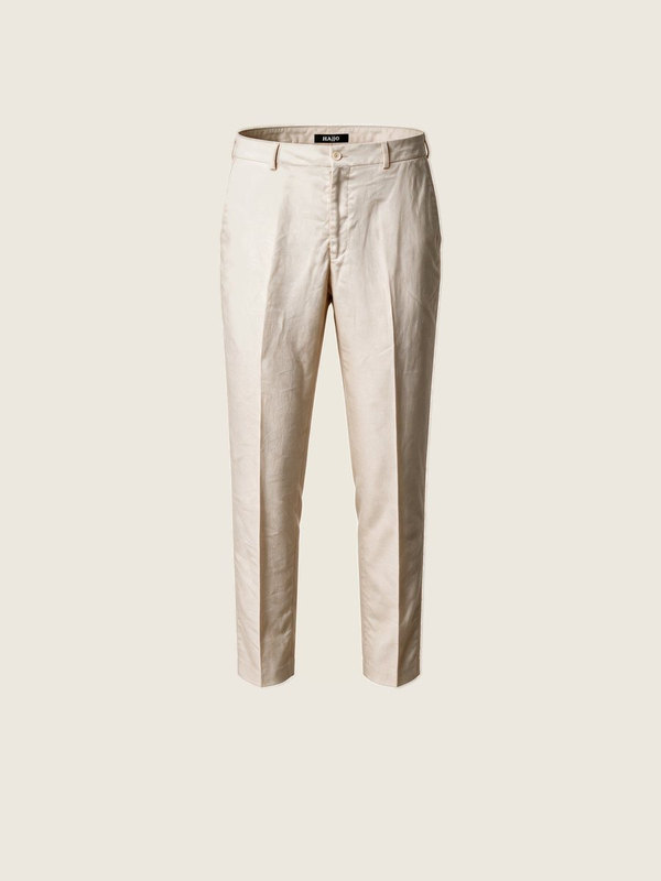 A pair of cream linen trousers with pleats.